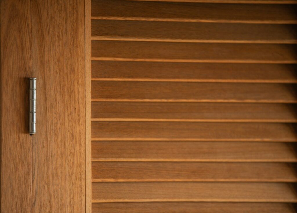 a wood surface with a metal bar